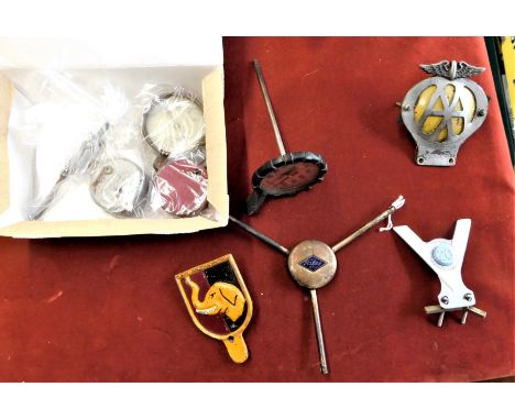 Automoblia collection of Car badges and parts (8) including: a Riley Motors 1930s Silver Plated Car Wheel central device, blu