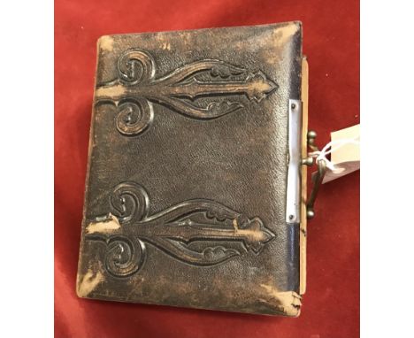 Victorian leather bound Ambrotype album with brass plated latch, the album hold (24) pictures, some wear. 