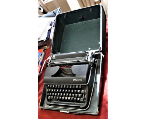 Olympia Model SM2 portable typewriter, manufactured in 1951 in West Germany and in very good condition with some wear to the 