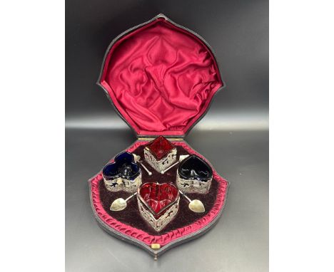 A Beautiful boxed set of Victorian four silver and glass salts modelled on the playing card suits of Hearts, Spade, Diamond a
