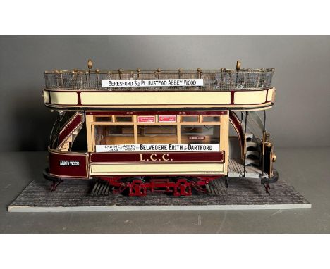 A scale model of a vintage train for the L.C.C Bereford Square, Plumstead, Abbey Wood line on plinth (H20cm W36cm)