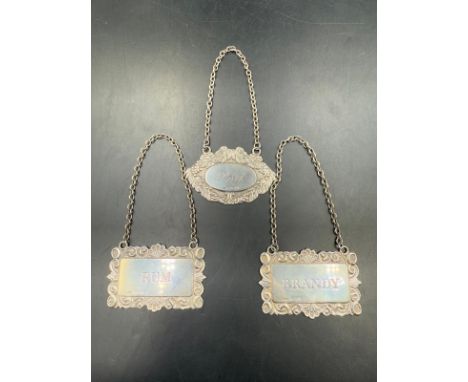 Three silver Port, Brandy and Rum decanter labels, hallmarked for Birmingham 1969 (approx weight 28g)
