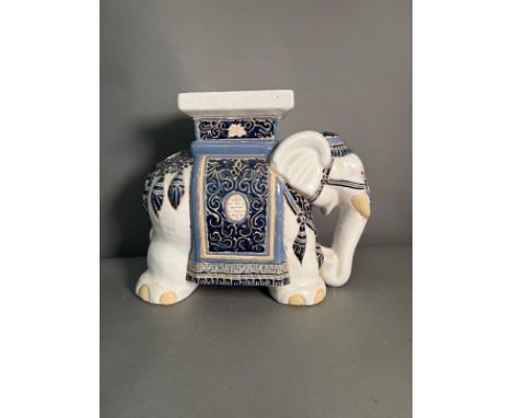 A ceramic blue and white elephant plant stand 