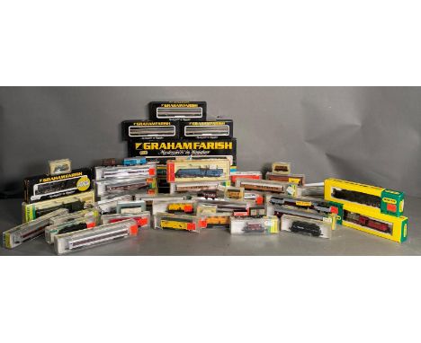 A quantity of boxed and unboxed N gauge railway engines and rolling stock, various makers to include Minitrix, Graham Farish 