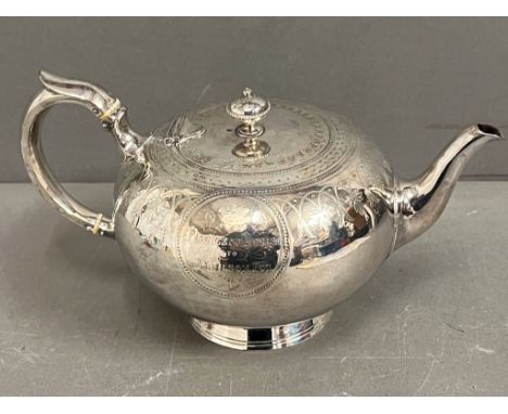 A Victorian silver  teapot of circular form with chased decoration to the body, inscription reads Princess house, Dr Wilson F