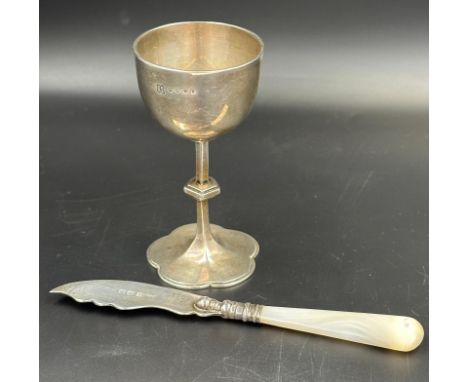 A hallmarked silver egg cup by Charles Reily & George Storer, London and hallmarked silver butter knife with mother of pearl 