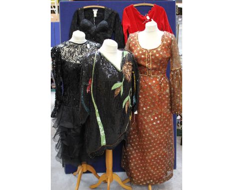 A princess line dress, decorated with gold roundalls, on a paisley floral background, late 1970s, Berkatex, a black early 198