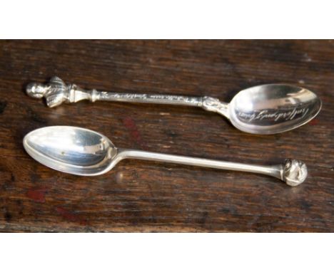 A George V silver teaspoon with cast dogs head finial, marked for Sheffield 1935 together with a silver William Shakespeare t