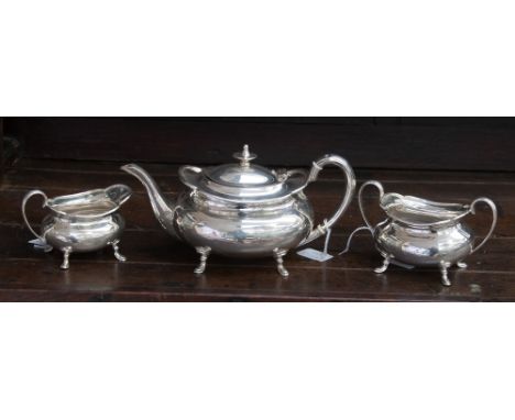 A George V silver three piece tea service to include tea pot, sugar bowl and cream jug, hallmarked Sheffield 1919 (3) 