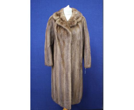 An early 1960s mink full length coat in light brown 