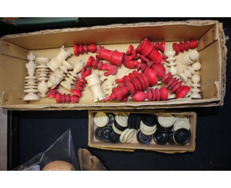 A stained red and ivory chess set; together with 19th Century drafts 