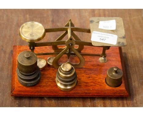 Set of brass weighing scales with weights