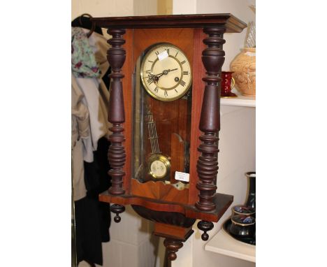 A German drop dial wall clock, having Roman numerals, pendant, key and eagle finial 