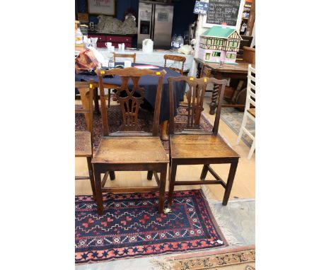 Two George III oak side chairs, in the manner of Thomas Chippendale, the shaped crest rails with pierced back splats and soli