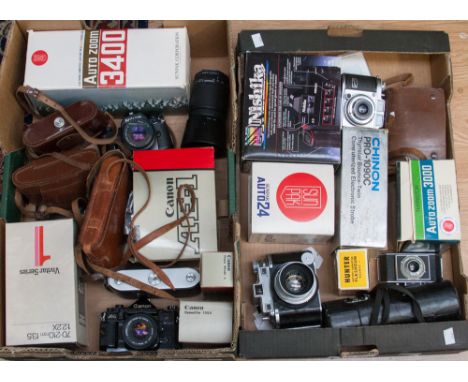 Two boxes of vintage cameras, including two Canon A-1 (one black and one chrome) a Nikon EM, a Kodak Medalist, etc 