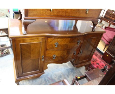 An early 20th Century mahogany sideboard, made by Harrison Gibson & Co, the centre of bow fronted form, fitted with two doors