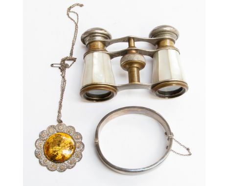 A silver bangle (Birmingham 1937) together with an Indian silver pendant with scene painted on mother of pearl and a pair of 