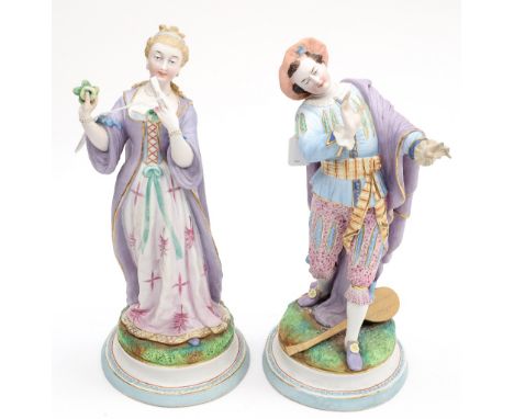 A pair of French figures, bisque porcelain, hand painted, one of a lady holding her fan and apple, the other of a man in a po