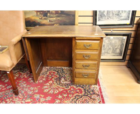 A 20th Century desk with four drawers 