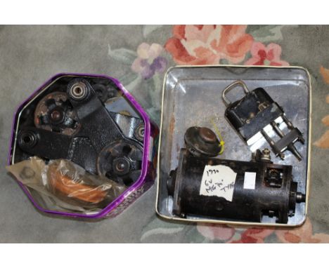A pair 5 1/2" x 6 1/2" Andre Harford friction shock absorbers in need of restoration, plus new friction material and spares, 