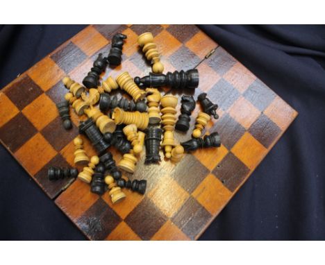 A wooden decorative chess set and folding board 