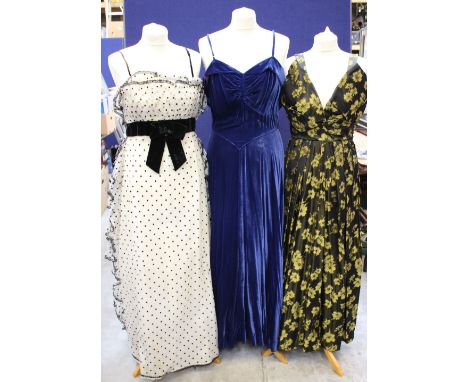 A cobalt blue late 1940s evening dress together with an empire line white and black spotted evening dress with velvet sash (s