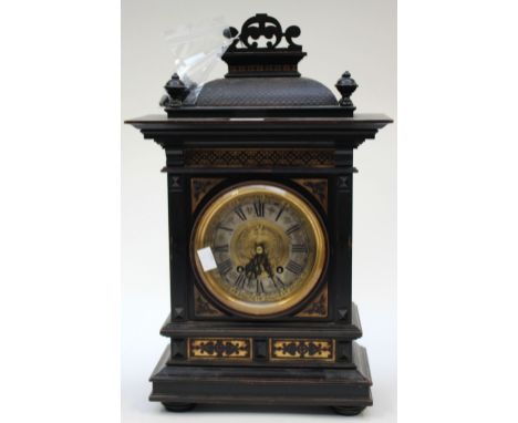 A late 19th Century gilt ebonised bracket clock of Baroque form (key and pendulum) 