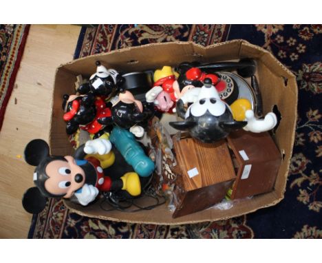 A box of Mickey Mouse telephones, clock, two modern Cuckoo clocks, etc 