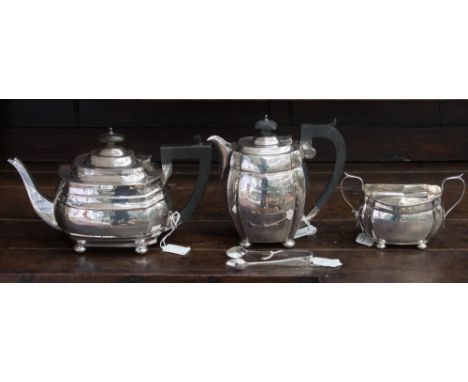 A matched silver three piece tea service, comprising teapot, hot water pot, sugar bowl and sugar tongs, the tea and hot water