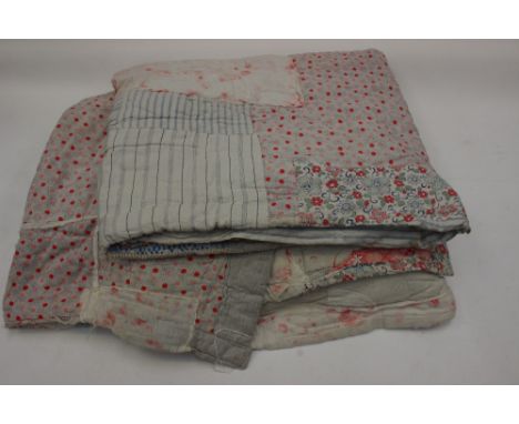A very chabby chic 1890s/1900s patch work quilt in very interesting cotton fabric - hand sewn and one machine made 