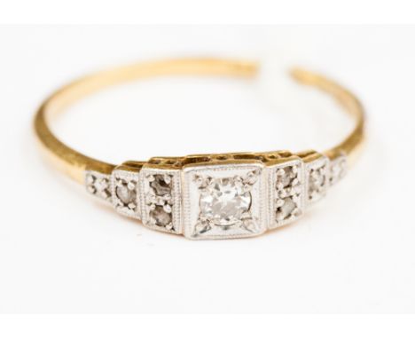 An Art Deco diamond set 18ct gold ring with diamond set step down shoulders, 2.7 grams approx  