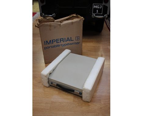An Imperial portable typewriter in box 