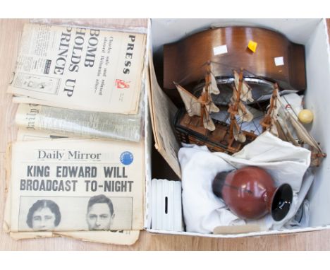 A mixed lot containing linen, mantle clock, old newspapers, model boat and elephant, with glass vase 