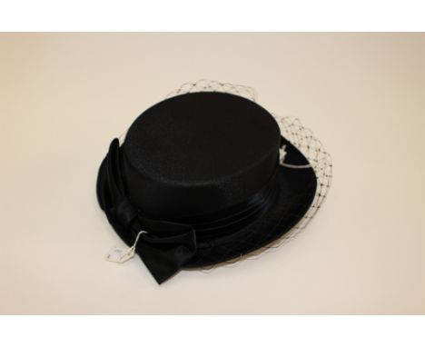 A fabric riding style top hat with a satin ribbon and bow and a net veil made by Headways in original Jessops hat box (late 1