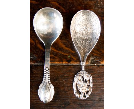 A Danish silver caddy spoon, mark for Evald Nielsen, 830 and 'Anno 1927' and Norwegian silver caddy spoon with ornate horse a