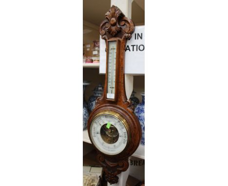 A late 19th Century oak cased barometer 