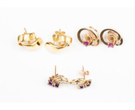 A pair of 14ct gold open knot stud earrings with detachable round ruby stud to the centre, together with a pair of 9ct amethy