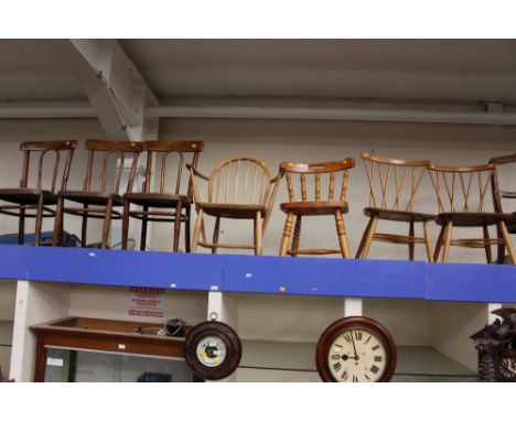 A collection of various chairs, comprising three bentwood chairs, three Ercol chairs and a pine kitchen chair, (7)
