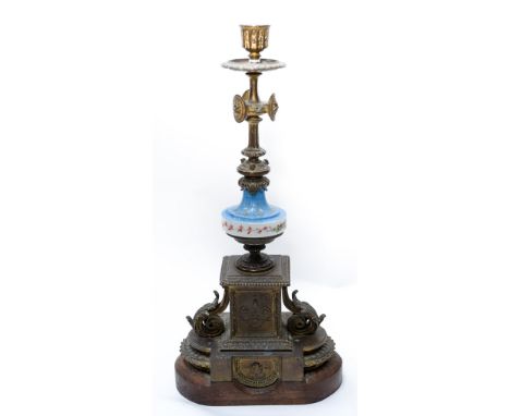 A 19th Century French ormolu and porcelain garniture candlestick, in the Rococo style, fitted with hand painted sevres style 