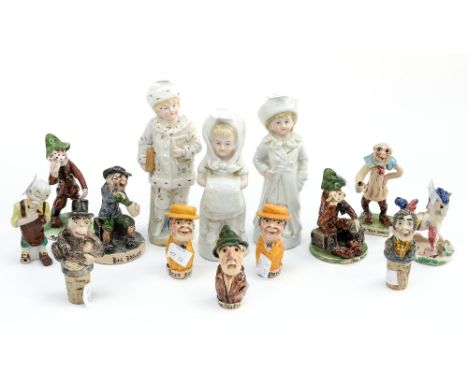 A collection of various ceramic character figures and cork bottle stoppers, plus three small German figures (one box)