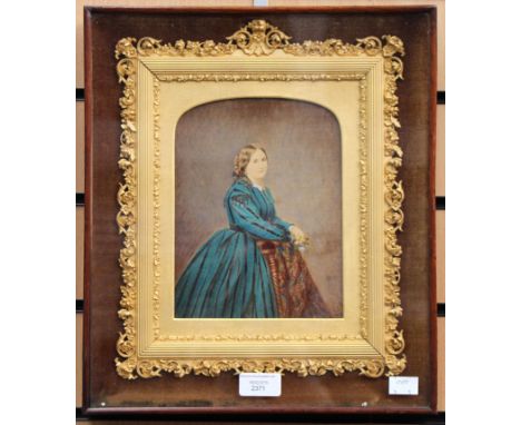 A Victorian over-painted photographic portrait in a gilt frame, glazed over