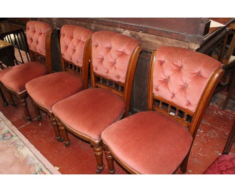 A set of four Victorian oak and button back chairs