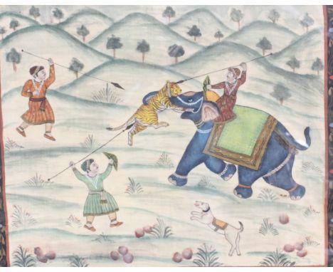 An Indo -Persian Painting on Silk 'Tiger Hunting' a bordered landscape study of an elephant attacking a tiger, framed and gla