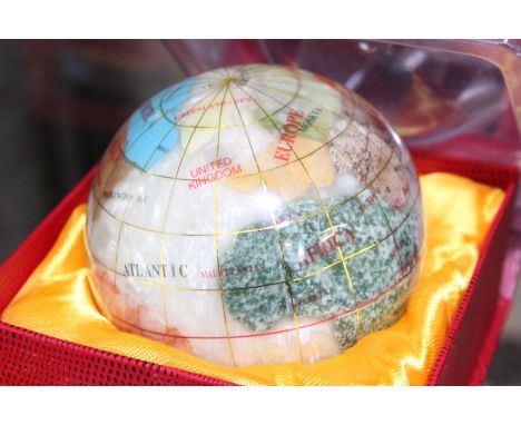 Six globe paperweights, boxed