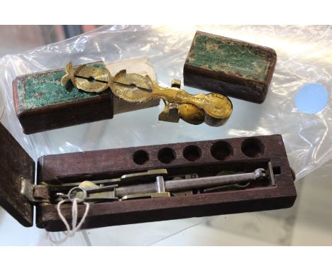 A Pocket sovereign scale signed 'Harrison' and a set of wooden cased folding pocket beam scales (2)