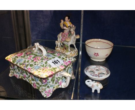 A floral decorated ceramic lidded trinket box, a model goat with riders and other item 