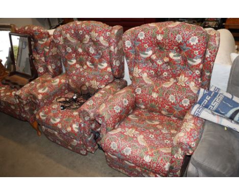 A pair of button back upholstered electric reclining armchairs 