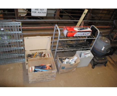 Four boxes containing various hand tools and fittings, shoe rack, tile cutter etc.