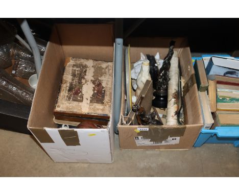 Two boxes of miscellaneous items to include a pair of spelter figures, pair of plaster book ends, a carved wooden elephant, v