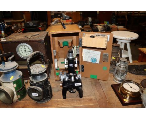 An Olympus microscope No.294046 in fitted case with various accessories